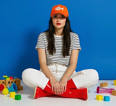 Change the blue hat to orange, the orange background to blue, and keep everything else the same in this photo.